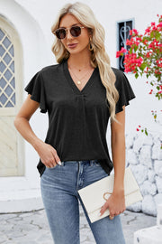 V-neck black top with pleated detail and flutter sleeves.