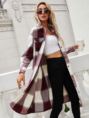 Burgundy plaid duster shirt jacket with button front and chest pockets.