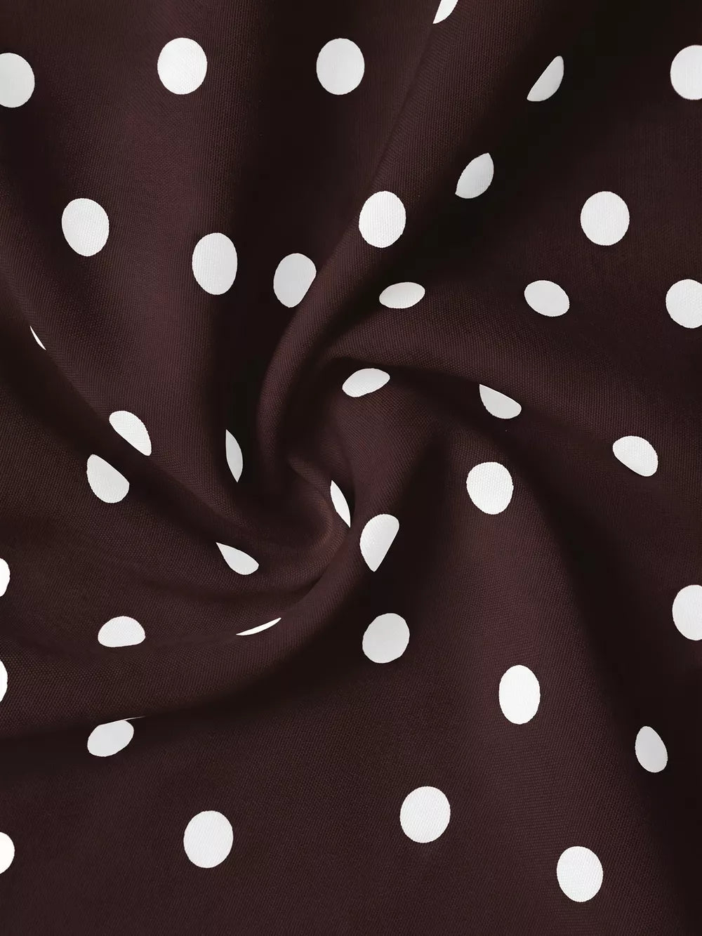 Brown polka dot camisole fabric with tie-back detail.