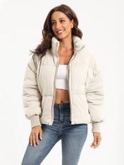 Padded bomber jacket in cream with ribbed cuffs and collar, full zip front.