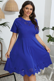 Royal blue midi dress with laser cutouts on neckline and hem, short sleeves, and flared skirt.