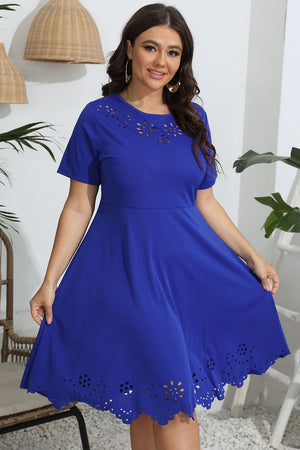 Royal blue midi dress with laser cutouts on neckline and hem, short sleeves, and flared skirt.