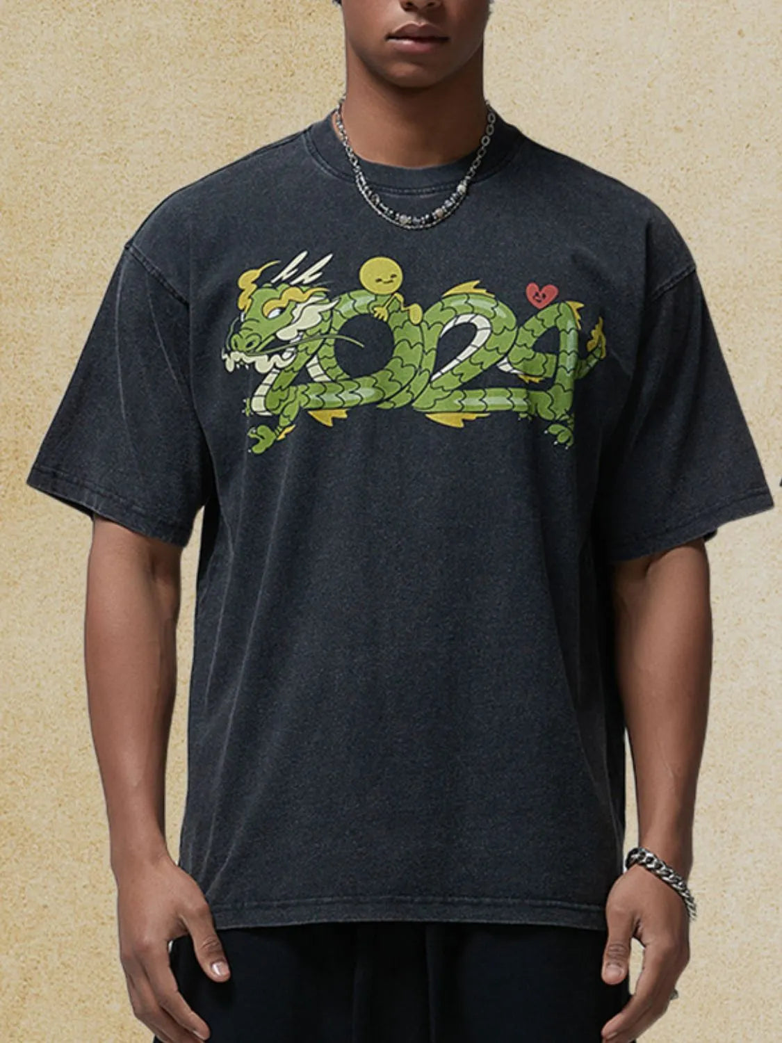 Black washed cotton tee with a green dragon graphic and a small yellow character.