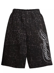 Grey leopard print sweatpants with white script logo detail on leg.