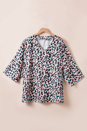 Color Pop Leopard Print Batwing Blouse with V-neck and wide sleeves.