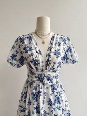 White and blue floral v-neck maxi dress with ruched waist and button detail