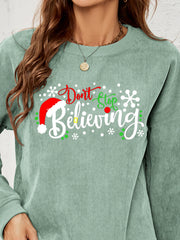 Sage corduroy crewneck sweatshirt with Christmas graphic and Santa hat detail.