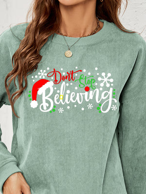 Sage corduroy crewneck sweatshirt with Christmas graphic and Santa hat detail.