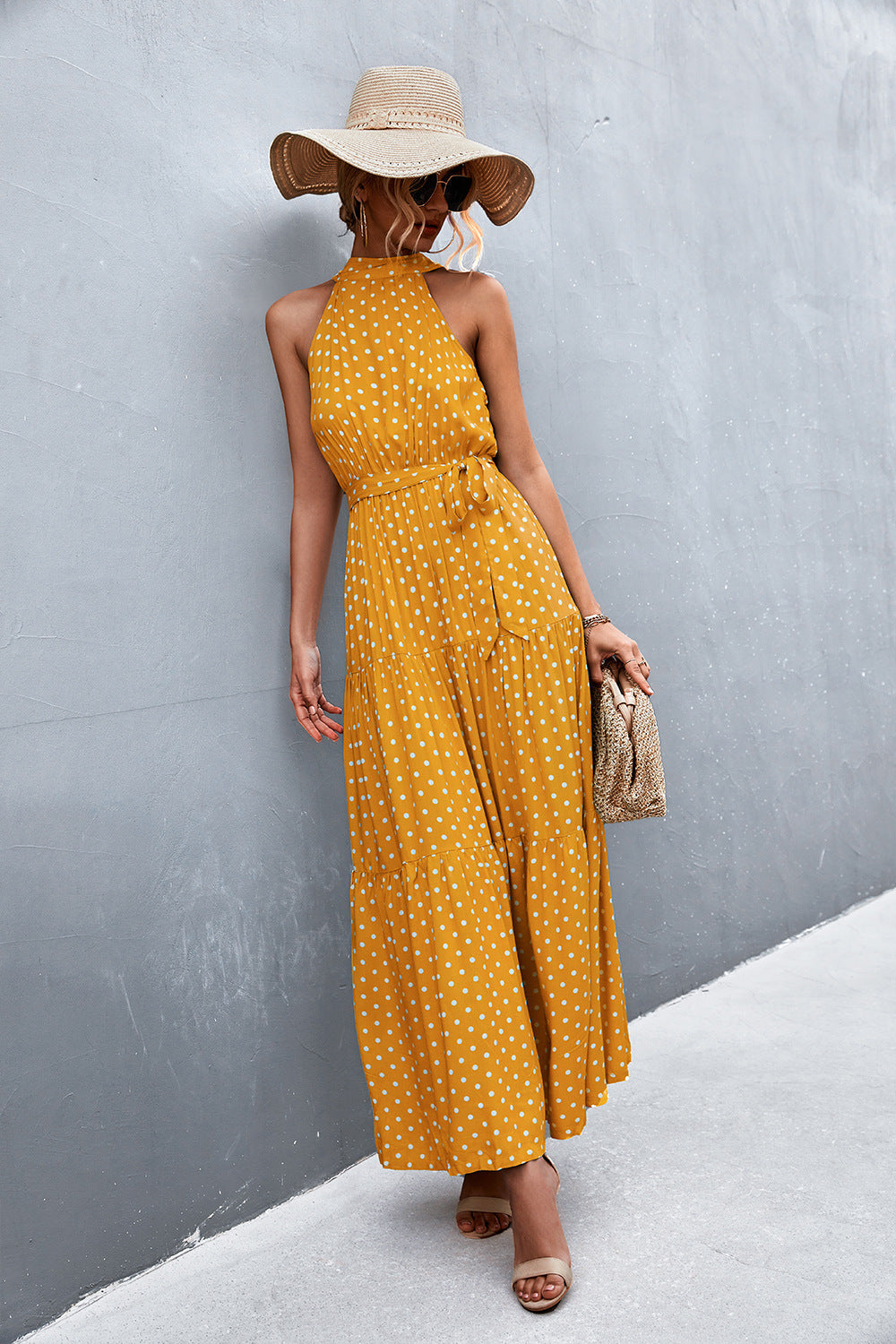 Yellow polka dot halter maxi dress with tie waist and tiered skirt