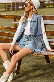 Light wash denim utility vest with button front and chest pockets.