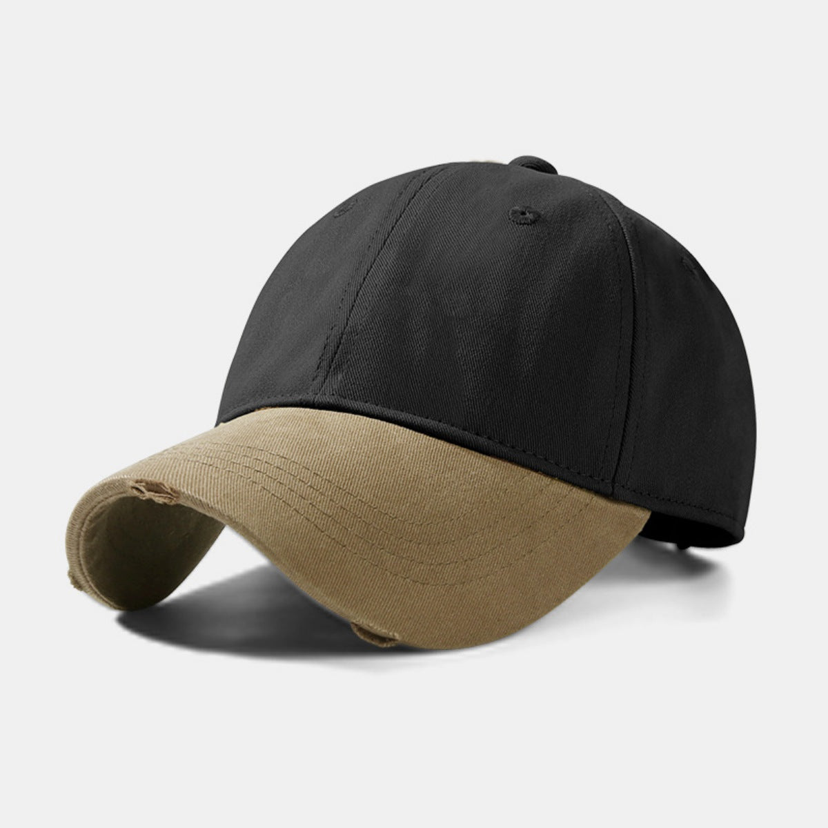 Distressed two-tone baseball cap in black and tan cotton with curved brim.