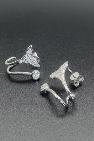 Silver crystal tail stud earrings and ring with clear cubic zirconia accents.