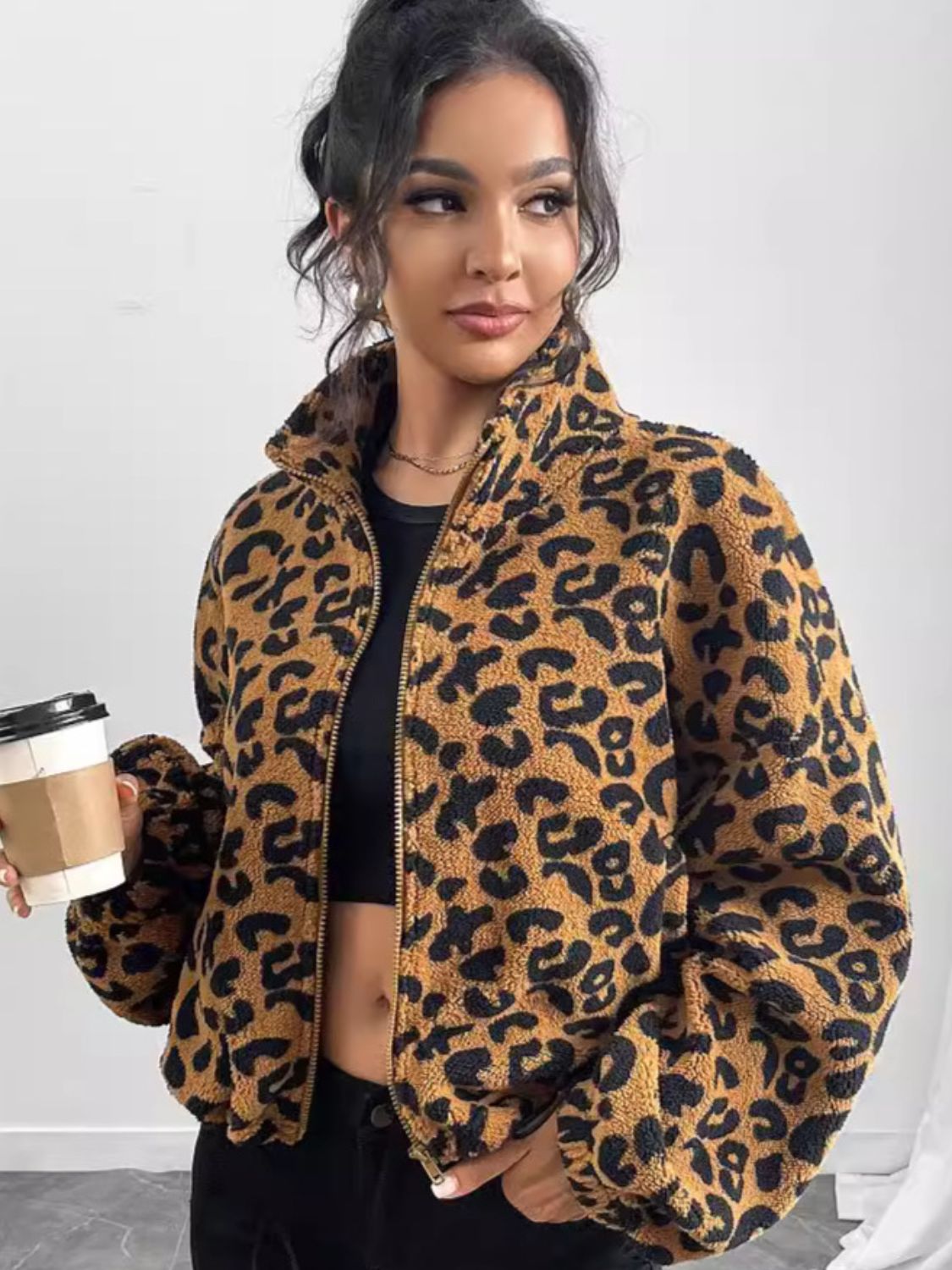 Caramel leopard print sherpa bomber jacket with a zip front and stand-up collar.