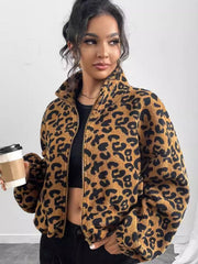 Caramel leopard print sherpa bomber jacket with a zip front and stand-up collar.