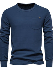 Navy textured thermal long sleeve tee with chest pocket and minimalist detail.