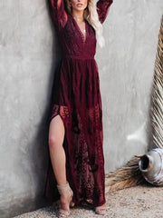 Burgundy floral lace maxi dress with V-neck, long sleeves, and high slit.