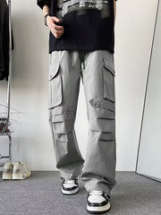Light gray wide-leg cargo pants with multiple flap pockets and button details.