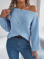 Off-the-shoulder Misty Blue knit sweater with openwork detail and V-neck.