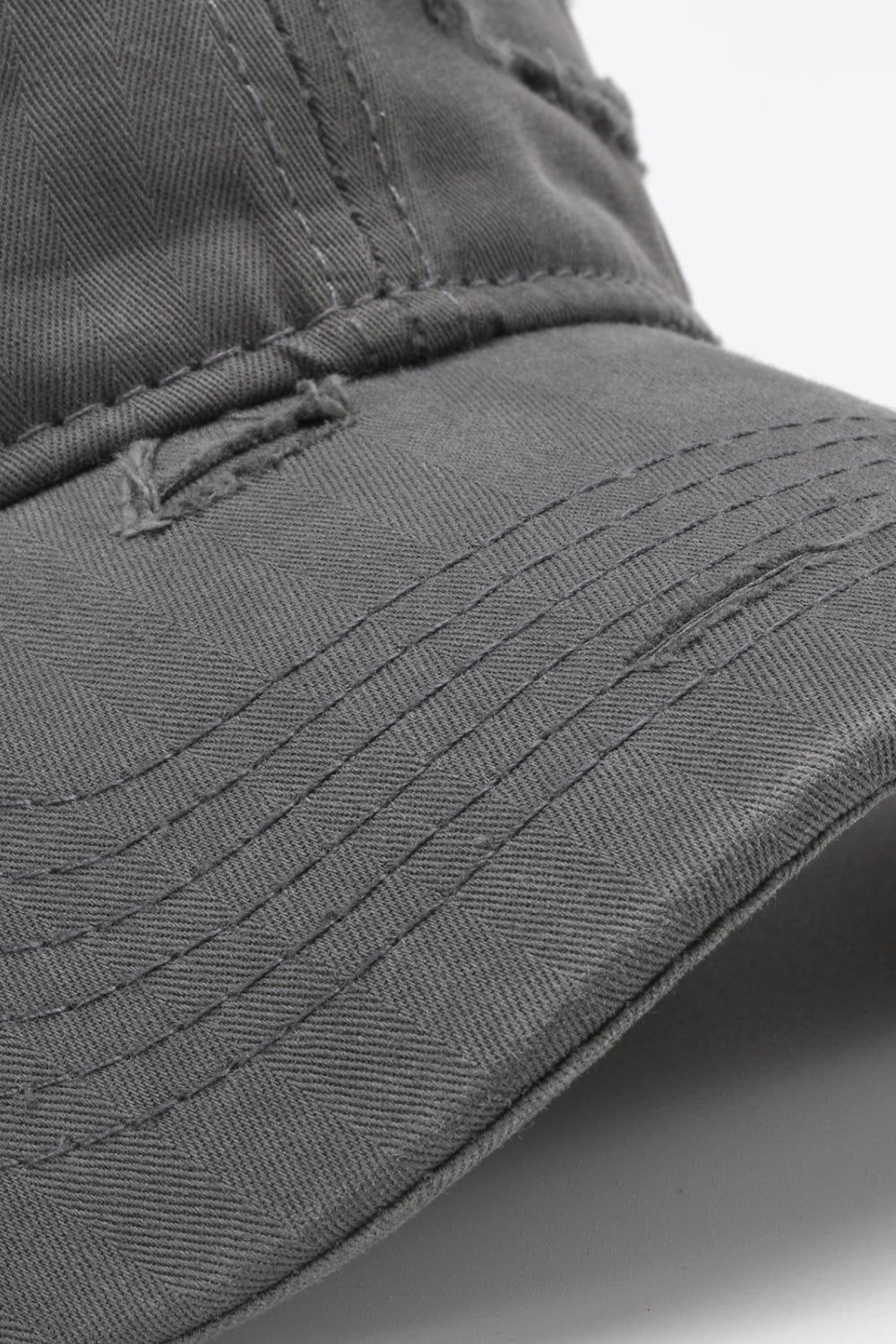 Mid Gray baseball cap with distressed details and herringbone pattern.