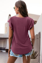 Burgundy ruffled sleeve tee with a scoop neck, styled with denim shorts.