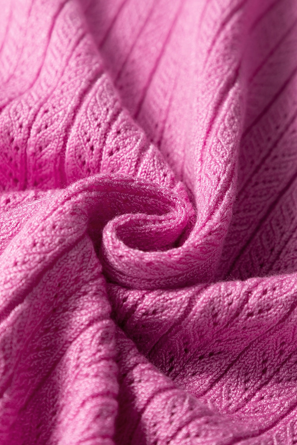 Red-violet knit blouse with square neckline and flutter sleeves, 100% viscose fabric detail.