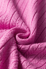 Red-violet knit blouse with square neckline and flutter sleeves, 100% viscose fabric detail.