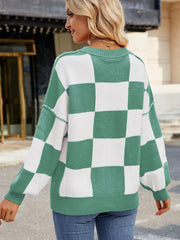 Checkerboard knit sweater in Gum Leaf green and white with balloon sleeves and crew neck.