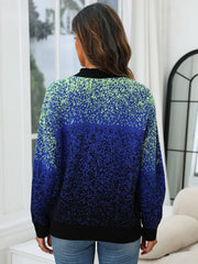 Speckled gradient knit cardigan in navy with a black collar and cuffs.