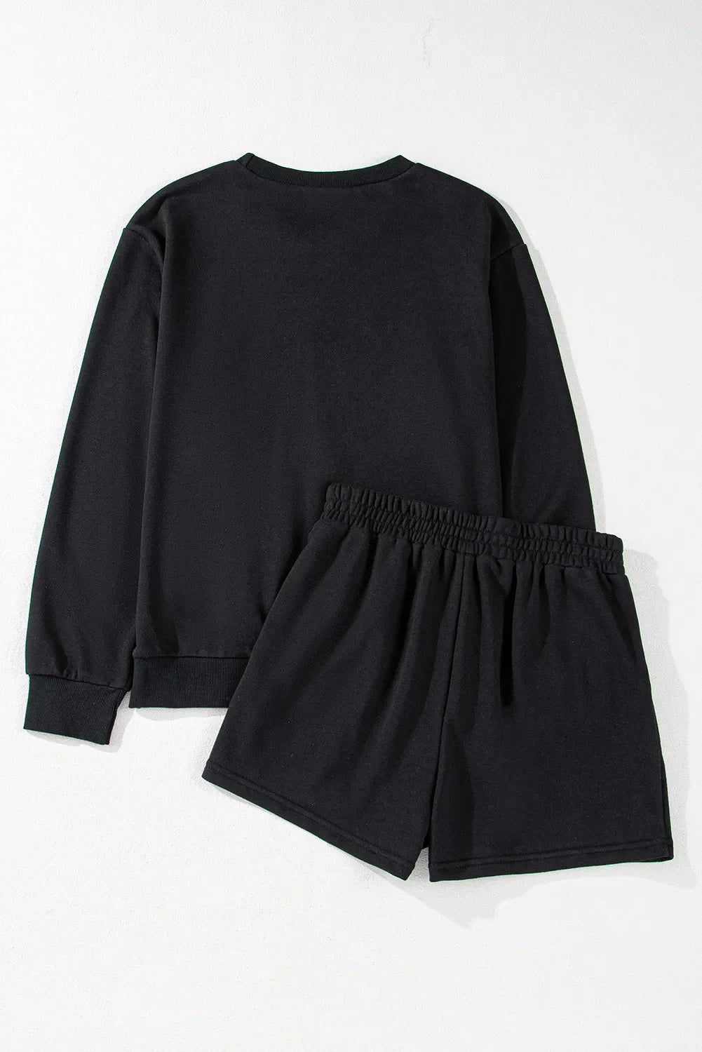 Black cotton sweatshirt and shorts set with elastic waistband.