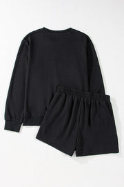 Black cotton sweatshirt and shorts set with elastic waistband.