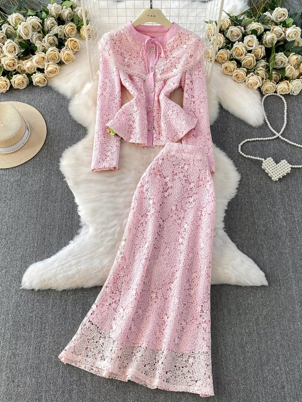 Blush pink lace peplum two-piece ensemble with button front and flared sleeves
