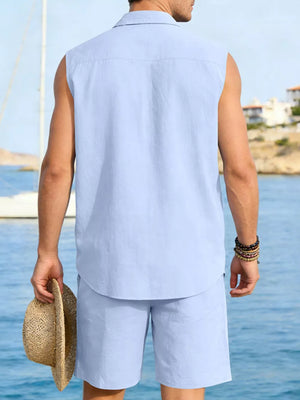 Men's sky blue linen two-piece set, sleeveless shirt and shorts, holding straw hat