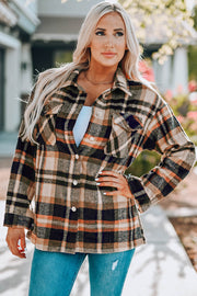 Soft plaid shacket with patch pockets and button front in khaki and black plaid.
