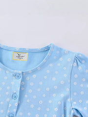 Baby blue cotton dress with white floral print and button front.