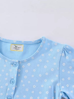 Baby blue cotton dress with white floral print and button front.