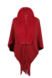 Red knit cape with faux fur collar and fringe detail