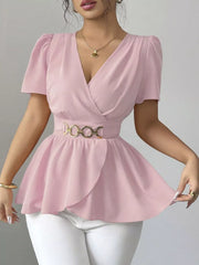 Pink surplice blouse with short puff sleeves, belted waist, and peplum hem.