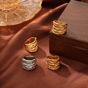Sculptural titanium bamboo rings in gold and silver with a stacked bamboo design.