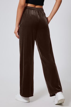 Velvet palazzo lounge trousers in coffee brown with a wide leg and elastic waistband.