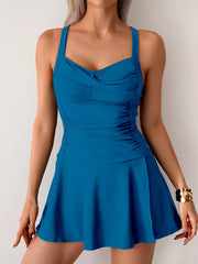 Royal blue one-piece swimsuit with sweetheart neckline, ruched sides, and a flared skirt.