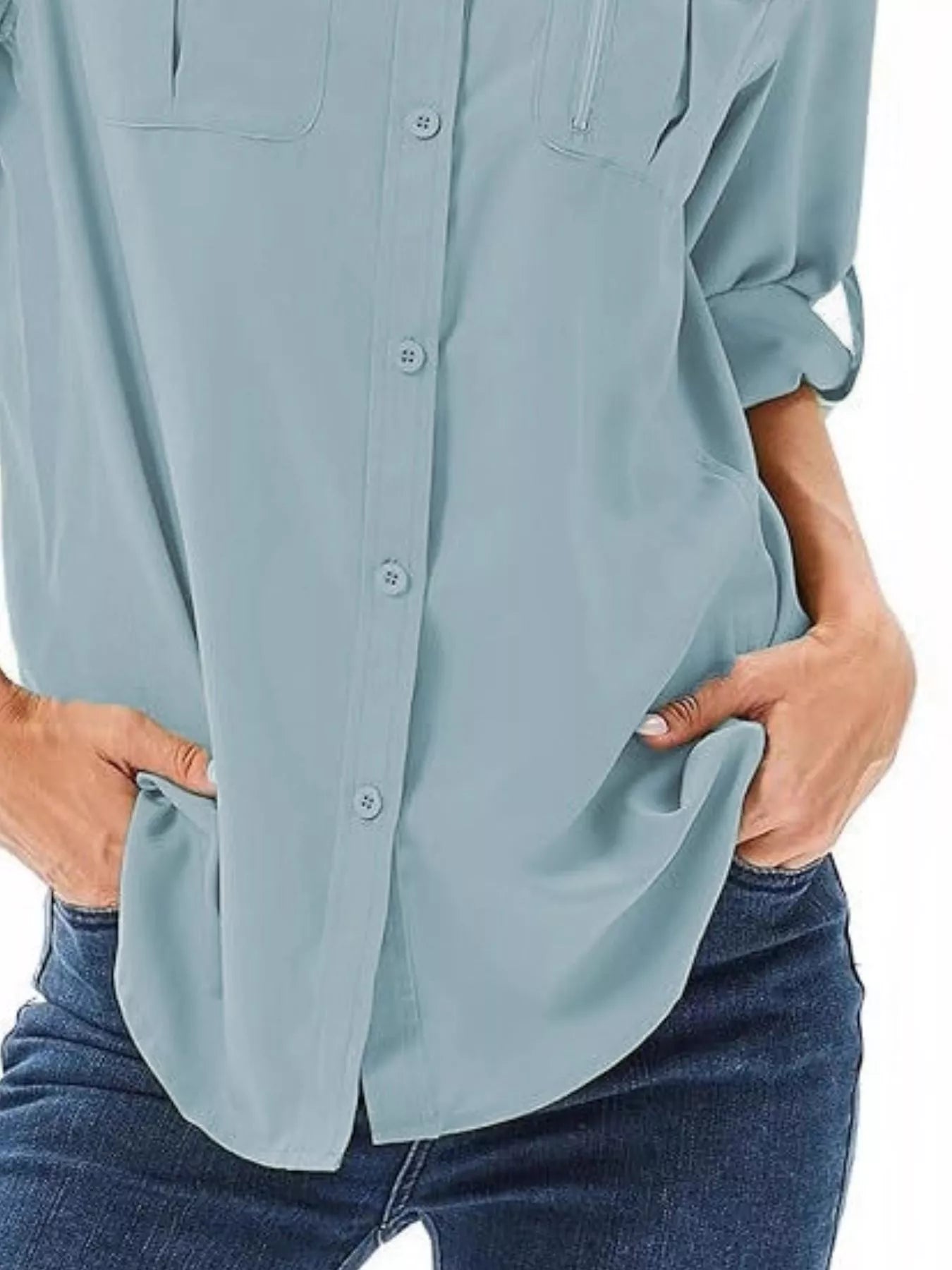 Sky blue button-up shirt with roll-up sleeves and chest pockets.