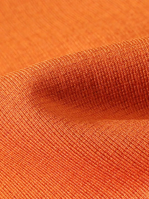 Orange long sleeve crew neck undershirt with ribbed texture.