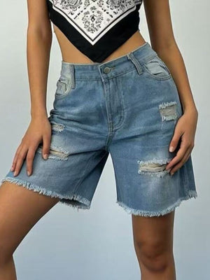 Light blue denim shorts with distressed rips and frayed hem.