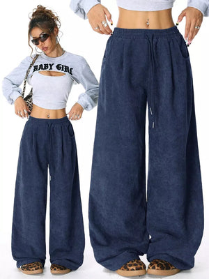 Dark blue corduroy maternity cargo pants with wide legs and drawstring waist.