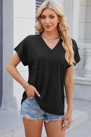 Dolman sleeve slouchy v-neck top in black with a relaxed fit.