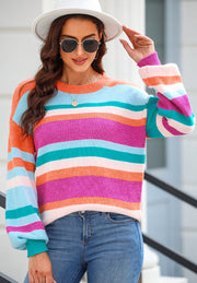 Rainbow stripe knit sweater with balloon sleeves and crew neck.