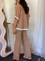 Camel outfit set with half-sleeve top and pants, featuring white scalloped trim.