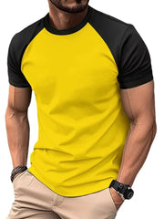 Colorblock raglan tee in gold with black sleeves, crew neck, and casual fit.