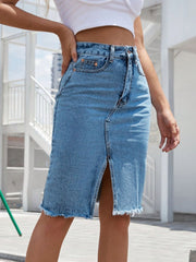 Slit-front frayed denim pencil skirt in light blue with a raw hem.