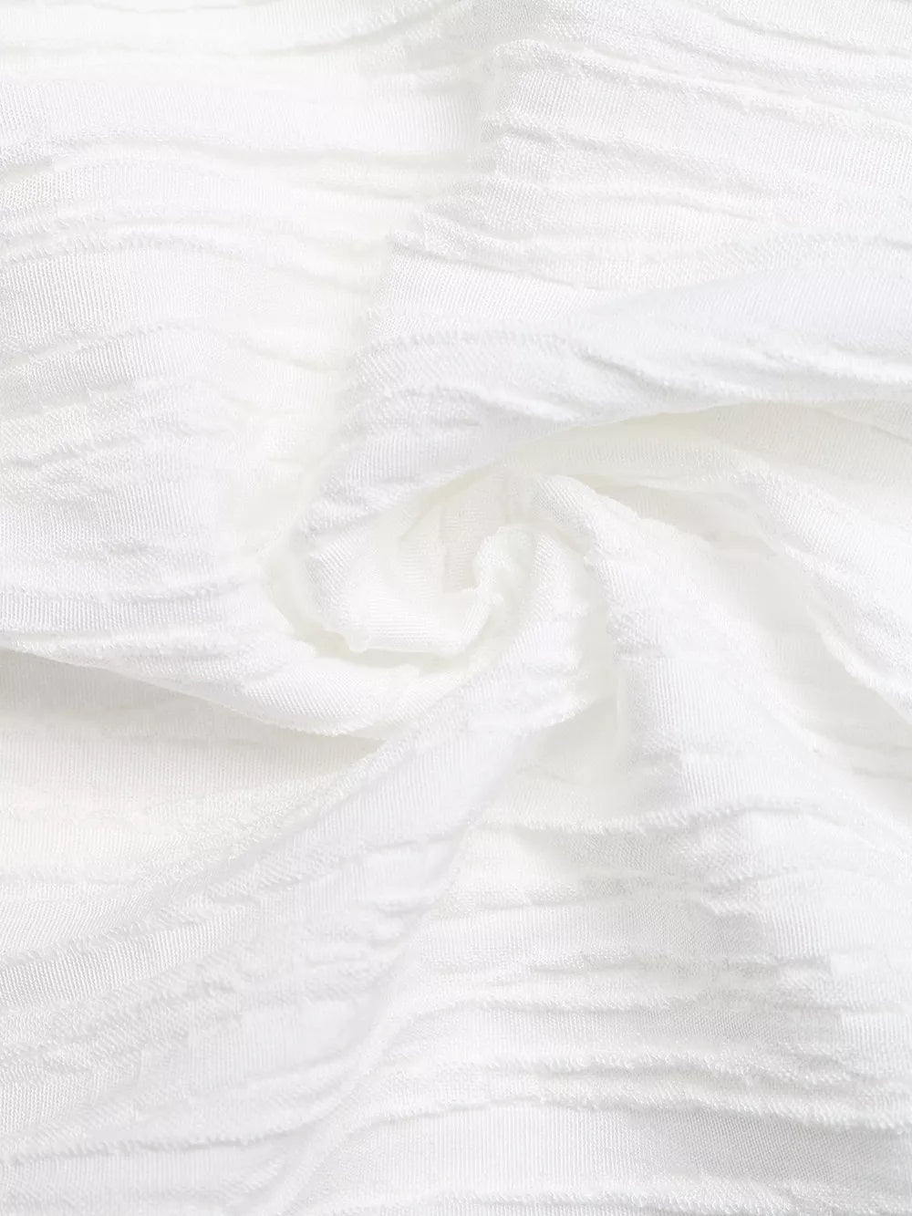 White textured maternity blouse with cap sleeves and bow detail